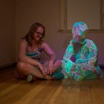 Marian Sandberg, Small Language Model, 2025<br />
3D printed noctilucent plastic on nylon jersey, bricklayers twine, UV light.<br />
1.5m x 1.2m x 1.2m<br />
Photo: Sam Roberts
