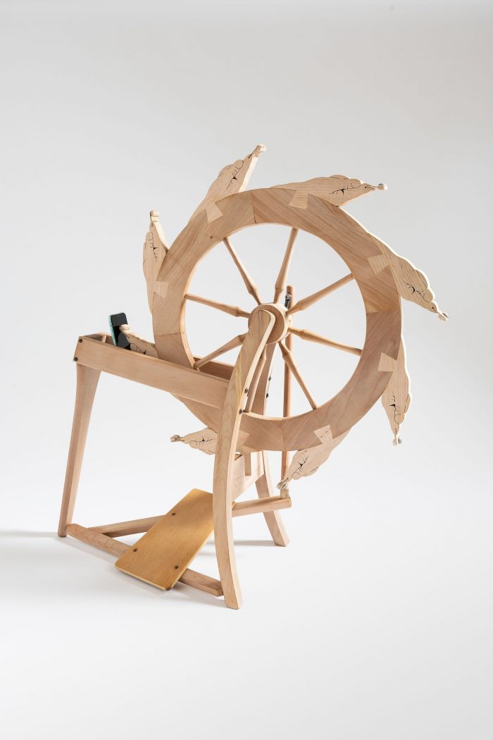 Marian Sandberg, Scroll Wheel, 2022, Found spinning wheel, wood, conductive fabric, leather, iPhone, motor and microcontroller, 85cm x 85cm x 36cm, Photograph: James Field